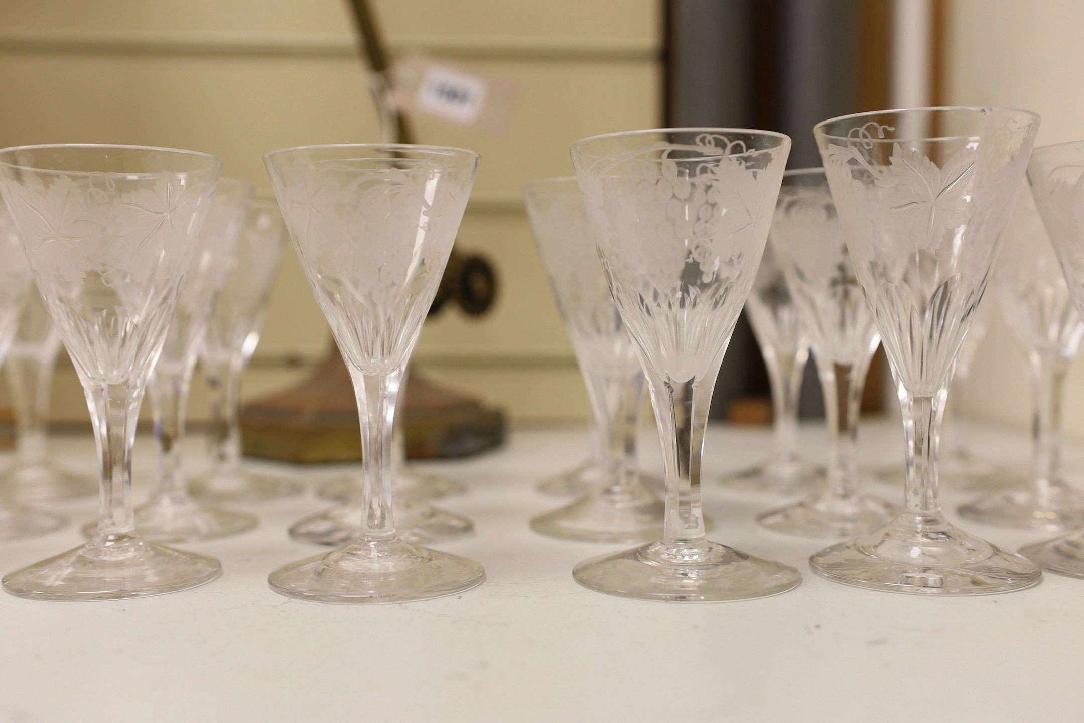 A collection of vine engraved aperitif glasses